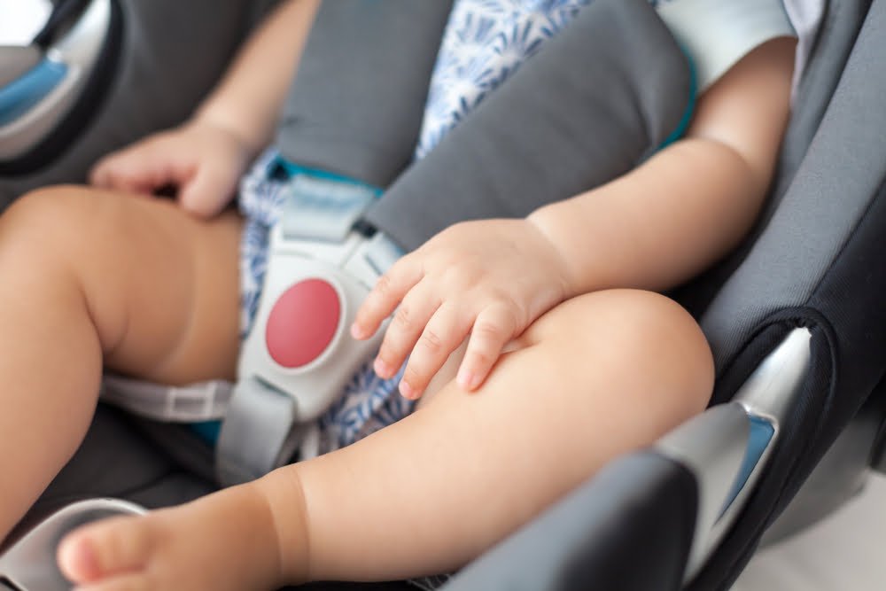 Child sleeping in car seat